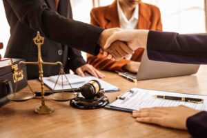 Financial crime defense Criminal Defense Attorney Stretching Hands with Client