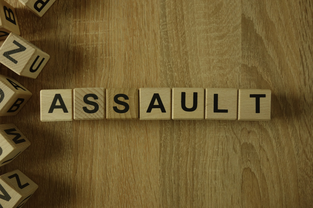 Wooden blocks spelling assault, representing criminal assault charges in Nebraska