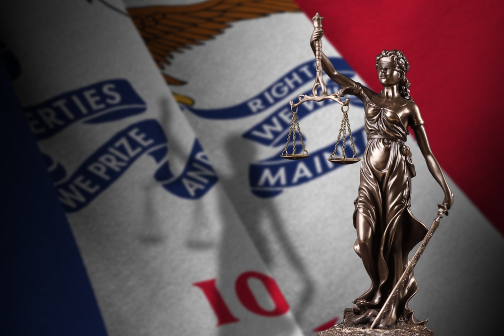 Stylized image of Iowa State Flag with scales of justice