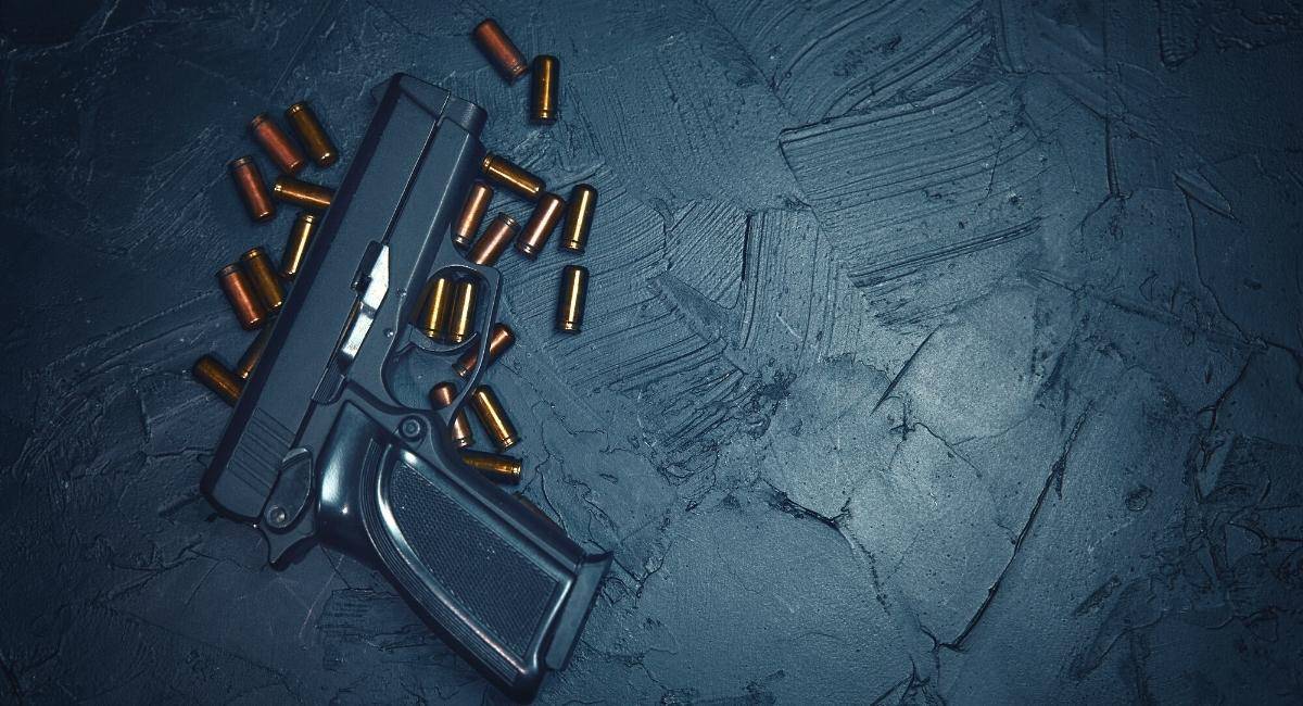 Stylized image of handgun and ammunition